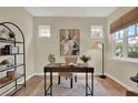 Bright home office space featuring neutral paint, natural light, and a minimalist aesthetic at 8245 Laureate Blvd, Orlando, FL 32827