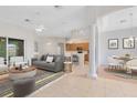 Open concept living room featuring a modern fireplace, couch, and lots of seating at 9330 Shadow Pinar Ct, Orlando, FL 32825