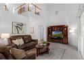 Bright living room boasting soaring ceilings, neutral colors, and tile floors, creating a spacious atmosphere at 10125 Sandy Marsh Ln, Orlando, FL 32832