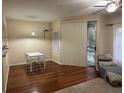 Open floor plan boasts wood floors, a sliding glass door, and comfortable seating at 2314 Mid Town Ter # 1126, Orlando, FL 32839