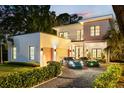 Beautiful modern home with a two-car garage, balcony, and well-maintained landscaping at 2412 Chantilly Ave, Winter Park, FL 32789