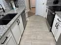 Modern kitchen featuring stainless steel appliances, granite countertops, stylish backsplash, and ample cabinetry at 2778 Almaton Loop # 302, Kissimmee, FL 34747