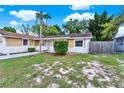 Well-kept home with stone accents, colorful exteriors, and manicured landscaping at 2809 Pioneer Rd, Orlando, FL 32808