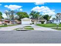 Inviting one-story home with an attached garage, spacious driveway, and easy street access at 2809 Pioneer Rd, Orlando, FL 32808