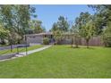Charming home with a well-manicured lawn, gray brick, and inviting walkway at 300 Hickory Ct, Apopka, FL 32712