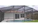 Screened-in pool area and well-maintained backyard with lots of privacy at 3156 Natoma Way, Orlando, FL 32825