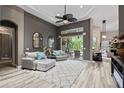 Comfortable living area showcasing neutral tones, recessed lighting, and patio access at 3400 Rose Mallow Loop, Oviedo, FL 32766