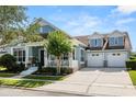 Charming two-story home featuring a three-car garage and inviting front porch at 4608 Atwood Dr, Orlando, FL 32828