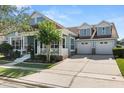 Charming two-story home featuring a three-car garage and inviting front porch at 4608 Atwood Dr, Orlando, FL 32828