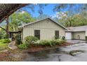 View of charming single-story home showing the garage and side entrance at 4772 Lake Ridge Rd # 66, Orlando, FL 32808