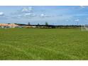 Large green soccer field with nets and distant view of homes being built at 7116 Cherry Pasture Rd, Groveland, FL 34736