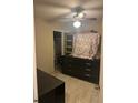 Bedroom featuring a ceiling fan and ceramic tile at 7625 Jarvis Ct, Orlando, FL 32818