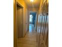 Hallway with neutral-toned walls and ceramic-tile flooring at 7625 Jarvis Ct, Orlando, FL 32818