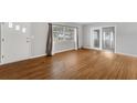 Bright living room with hardwood floors and views of the front yard at 826 S Montgomery Ave, Deland, FL 32720