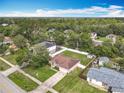 Aerial view of home with fenced backyard, mature trees, and neighborhood at 970 Courtland Blvd, Deltona, FL 32738