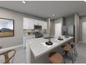 Modern kitchen with stainless steel appliances, granite countertops, and a breakfast bar with seating at 1123 Cumberland Trail Dr, Lake Hamilton, FL 33851