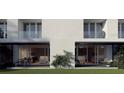 Townhouse exterior showcasing a covered patio area and modern architectural design at 11302 Westwood Blvd # 28, Orlando, FL 32821