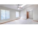 Bright living room with tile flooring, a skylight, a ceiling fan and wood trim at 1241 Leatherwood Dr, Altamonte Springs, FL 32714