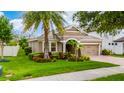 Beautiful single-story home featuring mature trees, lush landscaping, and a paver driveway at 15862 Citrus Grove Loop, Winter Garden, FL 34787