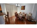 Cozy dining room features a table with seating for six and natural light at 2157 Island Walk Dr, Orlando, FL 32824