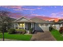 Inviting single-story home showcasing a well-manicured lawn and a two-car garage at 338 Wooded Vine Dr, Winter Springs, FL 32708