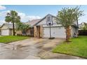 A well-maintained home featuring a two-car garage and basketball hoop on the driveway at 520 Starstone Dr, Lake Mary, FL 32746