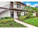 Charming condo featuring well-maintained landscaping and a cozy balcony entrance at 600 Northern Way # 103, Winter Springs, FL 32708