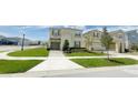 Beautiful suburban home with a green lawn and a welcoming two-story facade in a Gathering-friendly neighborhood at 8940 Coconut Breeze Dr, Kissimmee, FL 34747