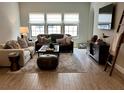 Comfortable living room with ample seating, natural light, and stylish decor at 1266 Spotted Sandpiper Loop, Winter Springs, FL 32708