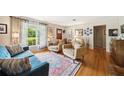 Cozy living room with large windows, plush seating, hardwood floors, and tasteful décor at 1516 Arthur St, Orlando, FL 32804