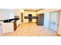 Well-lit kitchen with stainless steel appliances, white cabinets, and granite countertops, ideal for cooking at 15637 Carina Dr, Orlando, FL 32828