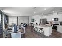 Bright, open-concept living space with modern kitchen, dining area, and living room, perfect for entertaining and comfortable living at 16341 Lakelet Aly, Winter Garden, FL 34787