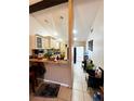Open-concept design with breakfast bar perfect for entertaining and modern decor at 2716 Upsandown St, Orlando, FL 32837