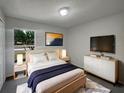 Comfortable bedroom with neutral walls, soft lighting, and modern decor at 3090 Yorkshire Dr, Deltona, FL 32738