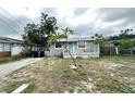 Cozy one-story home with a quaint front porch, simple design, and easy access to neighborhood amenities at 332 S Observatory Dr, Orlando, FL 32835