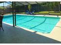 Inviting screened-in pool area offering a refreshing oasis for relaxation and outdoor entertainment at 415 Seville Ave, Altamonte Springs, FL 32714