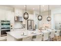 Spacious kitchen with stainless steel appliances, a large island, and pendant lighting, ideal for entertaining at 5652 Nevis Ter, Kissimmee, FL 34758