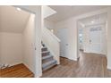 Inviting entryway with staircase, closet, and neutral color palette at 5896 Galloping Dr, Apopka, FL 32712