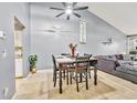 Open dining area with neutral paint and vaulted ceilings adjacent to the living room at 701 Saint Michael Ln, Altamonte Springs, FL 32714