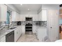 This bright kitchen includes stainless steel appliances and ample counter space at 737 Tanglewood Rd, Winter Springs, FL 32708