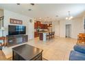 Spacious open-concept living area seamlessly blends into the kitchen, great for gatherings at 87 Delacorte Way, Oviedo, FL 32765