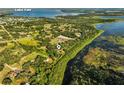 Aerial view of the home and surrounding area showcasing the property's proximity to Lake Yale at 40137 County Road 452, Leesburg, FL 34788