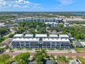 Stunning aerial view of modern townhomes nestled among mature trees and cityscapes at 42 W Harding St # E, Orlando, FL 32806