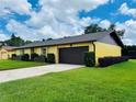 Beautiful single story home with an attached two car garage and a well manicured lawn at 4640 Chateau Rd, Orlando, FL 32808