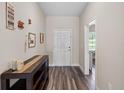 Inviting entryway featuring wood-look flooring and decorative accents at 4811 Sw 108Th Place Rd, Ocala, FL 34476