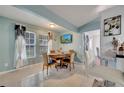 Cozy dining room featuring tile floors, a wooden table with seating for four, and bright natural light at 6017 Brookhill Ct, Orlando, FL 32810