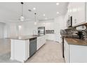 Spacious kitchen with a large island, stainless steel appliances, and a mosaic tile backsplash at 6139 Claystone Way, Mount Dora, FL 32757