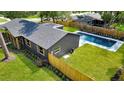 Aerial view of the home showcasing the backyard with a private pool and fenced yard at 1201 Manchester Rd, Maitland, FL 32751