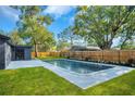 Backyard pool and patio area perfect for relaxing and entertaining guests in a private setting at 1201 Manchester Rd, Maitland, FL 32751