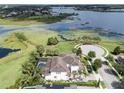 Sprawling home with a pool and a view of the lake, surrounded by mature trees and manicured lawns at 14285 United Colonies Dr, Winter Garden, FL 34787